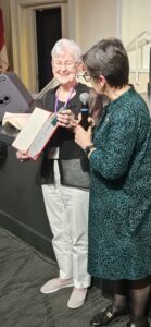 Sen. Kim Pate awarding Marie Burge with the King's Coronation Medal, June 2025