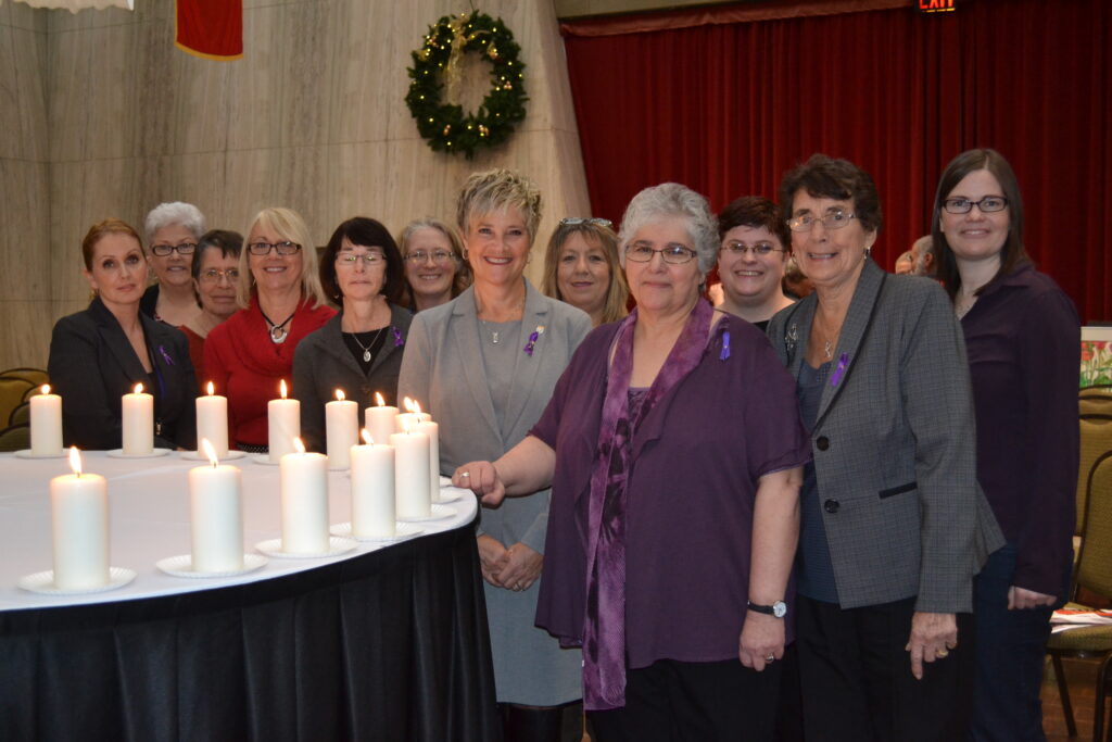 Council members and the Minister Responsible for the Status of Women at the Memorial Service in 2012.
